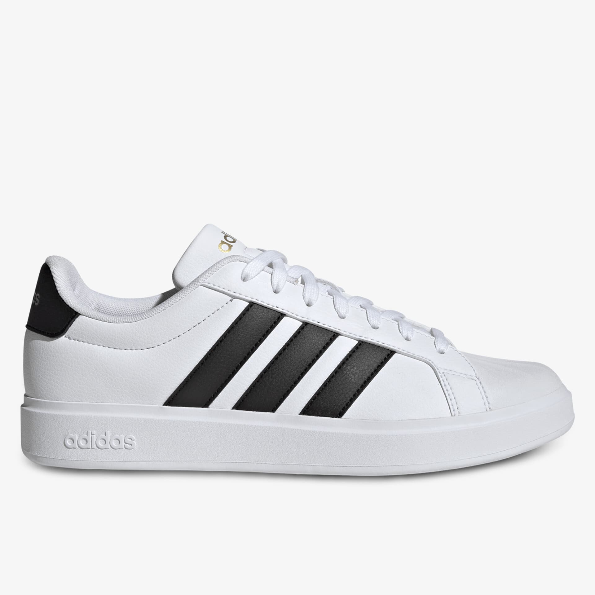 Seitliche Ansicht eines weißen Adidas Sneakers mit schwarzen Streifen und klassischem sportlichem Design