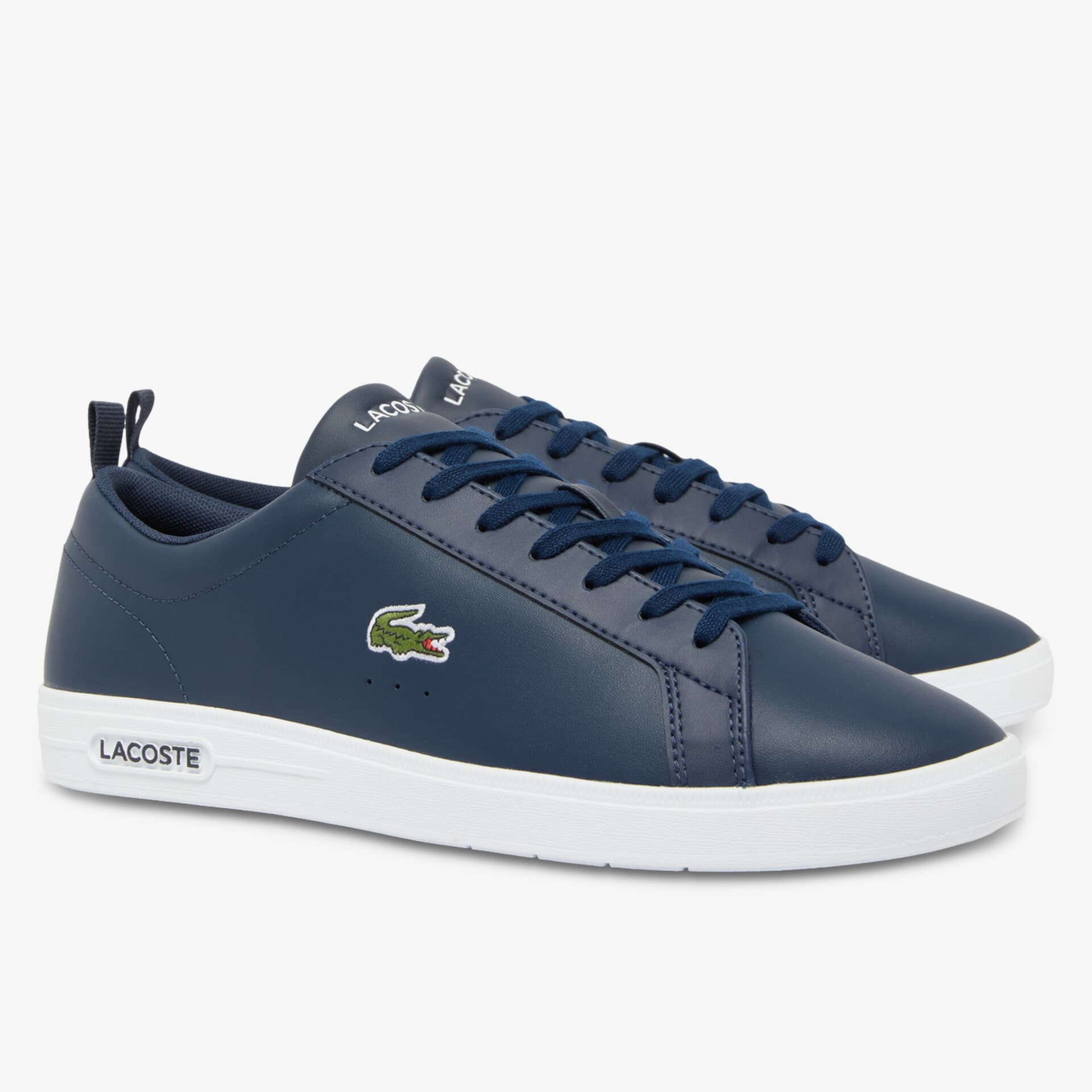 Elegante dunkelblaue Sneaker mit weißer Sohle und markantem Logo, ideal für sportlichen Alltag